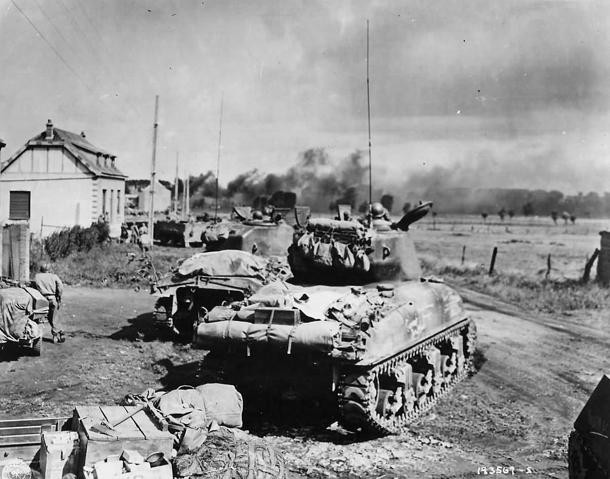 US_3rd_Armored_Division_M4_Sherman_Tanks_in_Action_in_Belgium_1944