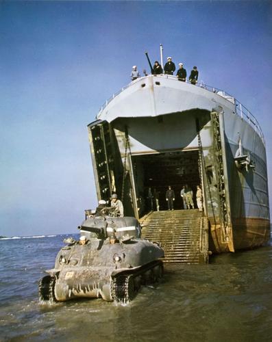 LST delivery an M4A1 to the beach, probably a 1st Armored Division tank to North Africa