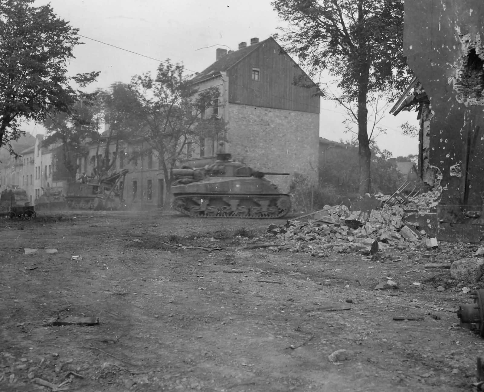 3rd_Armored_Division_M4_Sherman_and_T2_Grant_Recovery_Vehicle_Stolberg_Germany_1945