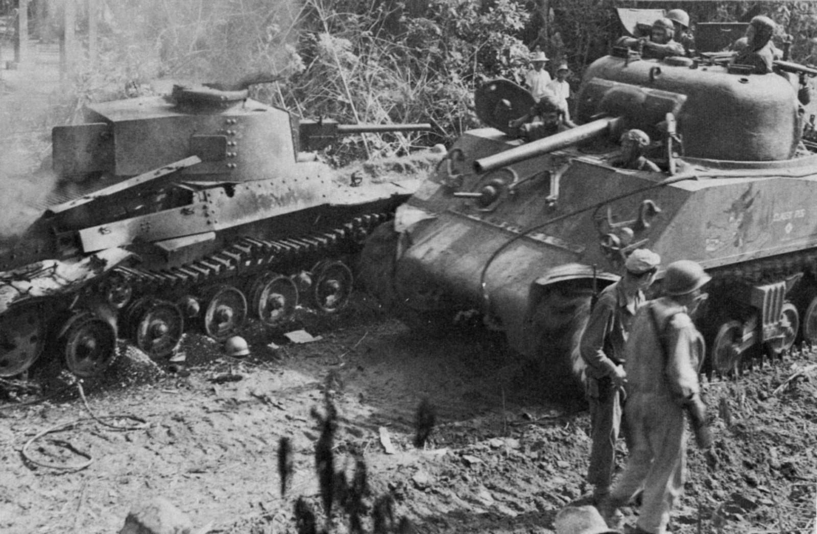 Classy-Peg-passing-destroyed-Japanese-Shinhoto-Chiha-tank-on-Luzon-in-the-Phillipines-17-Jan-1945