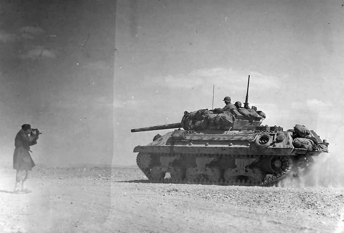 M10_Tank_Destroyer_Heads_To_Battle_Lines_At_Bir_Marbott_Pass_East_Of_El_Guettar_In_Tunisia_1943.
